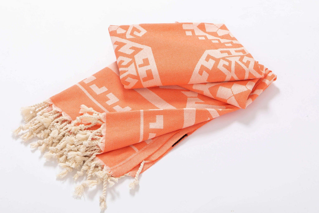 Orange beach towel aztec design