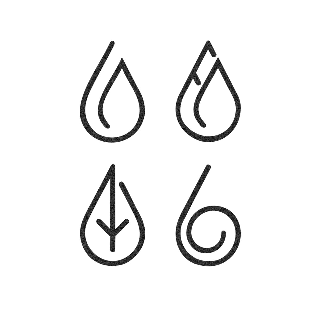 Close-up of black steel teardrop element symbols—powder-coated minimalist wall art.