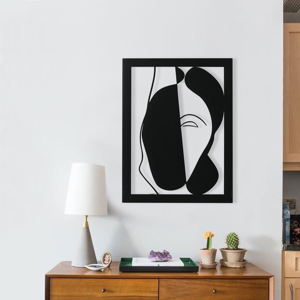 Abstract black face metal wall decor for contemporary interiors