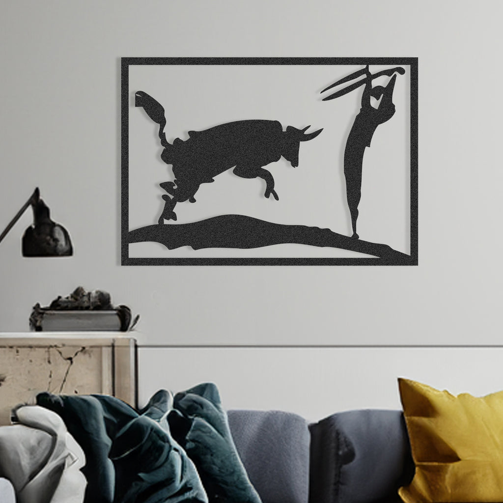 Close-up of matador and bull silhouette in matte black metal wall art.