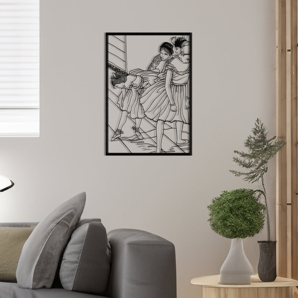 Ballet-inspired metal wall art featuring ballerinas at the barre, hanging on interior wall.