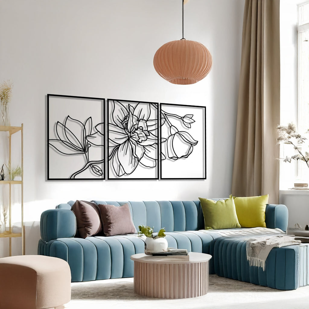 Elegant 3-piece floral metal wall art set displayed above a modern sofa in living room