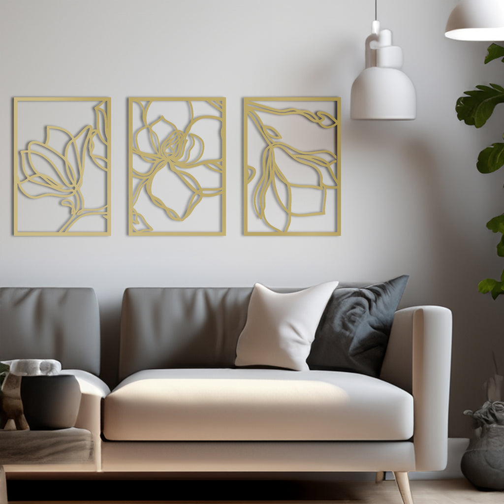 Side view of floral gold wall decor panels styled in a modern home.