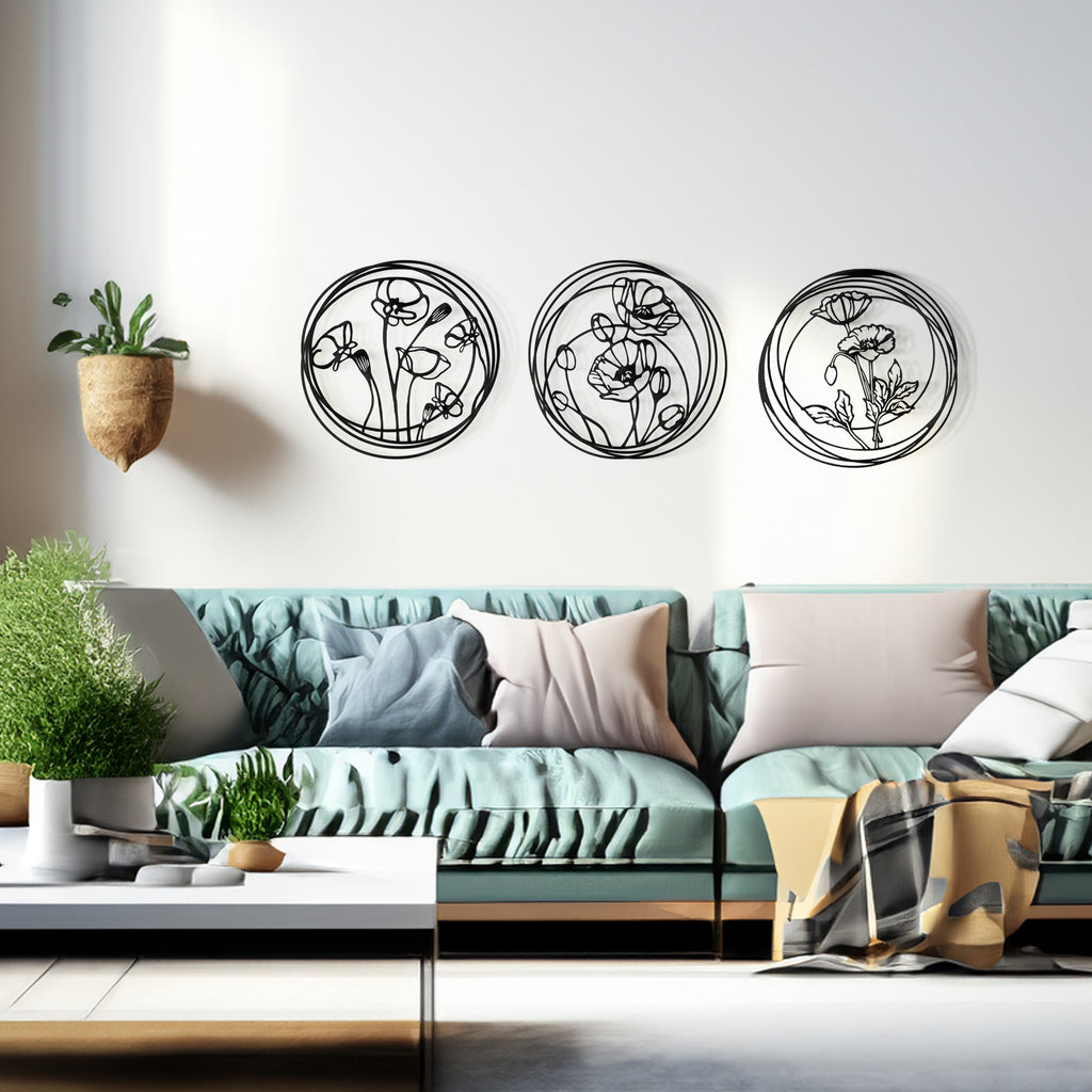 Modern living room with sofa and black floral metal wall art set of 3 round panels.