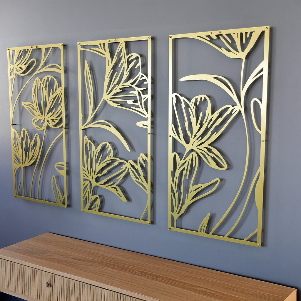 Close-up of gold floral line art panels with modern geometric frame