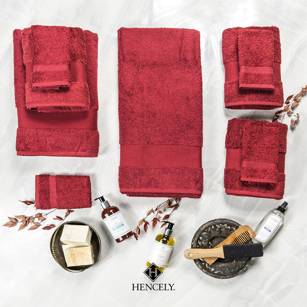 Hencely 2-pack red bath sheet set made of 100% cotton, displayed with skincare and spa accessories on white background