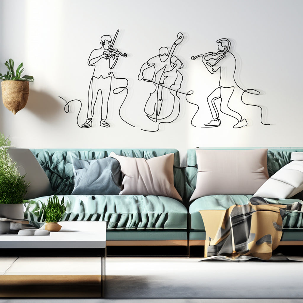 Line Art Musicians 3-piece black metal wall art set displayed in modern living room above sectional sofa – minimalist violinist and cellist design.