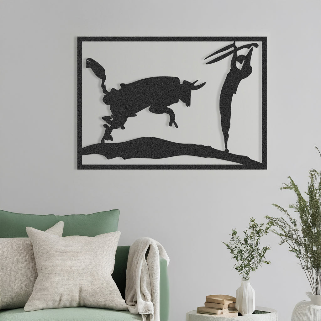 Matador and bull silhouette black metal wall art hanging in living room.