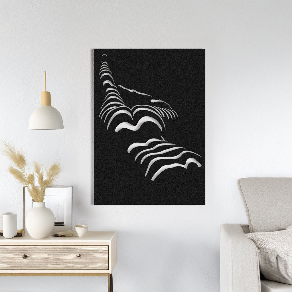 A modern black metal wall art depicting a silhouette of a woman in a minimalist style, displayed in a room setting with decorative items and furniture.
