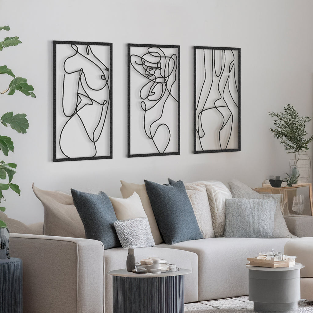 Modern black silhouette wall art displayed in minimalist interior